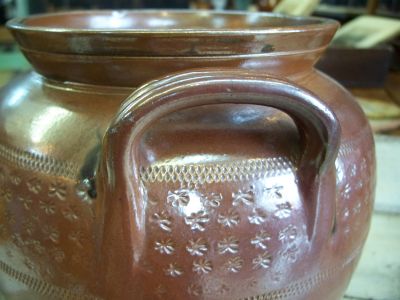 Nice old pottery jat with brown glaze and stars motives around 3