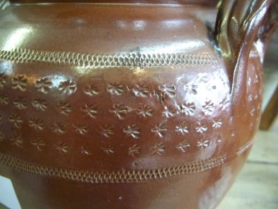 Nice old pottery jat with brown glaze and stars motives around 5