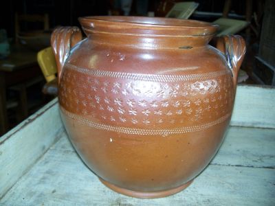 Nice old pottery jat with brown glaze and stars motives around 1